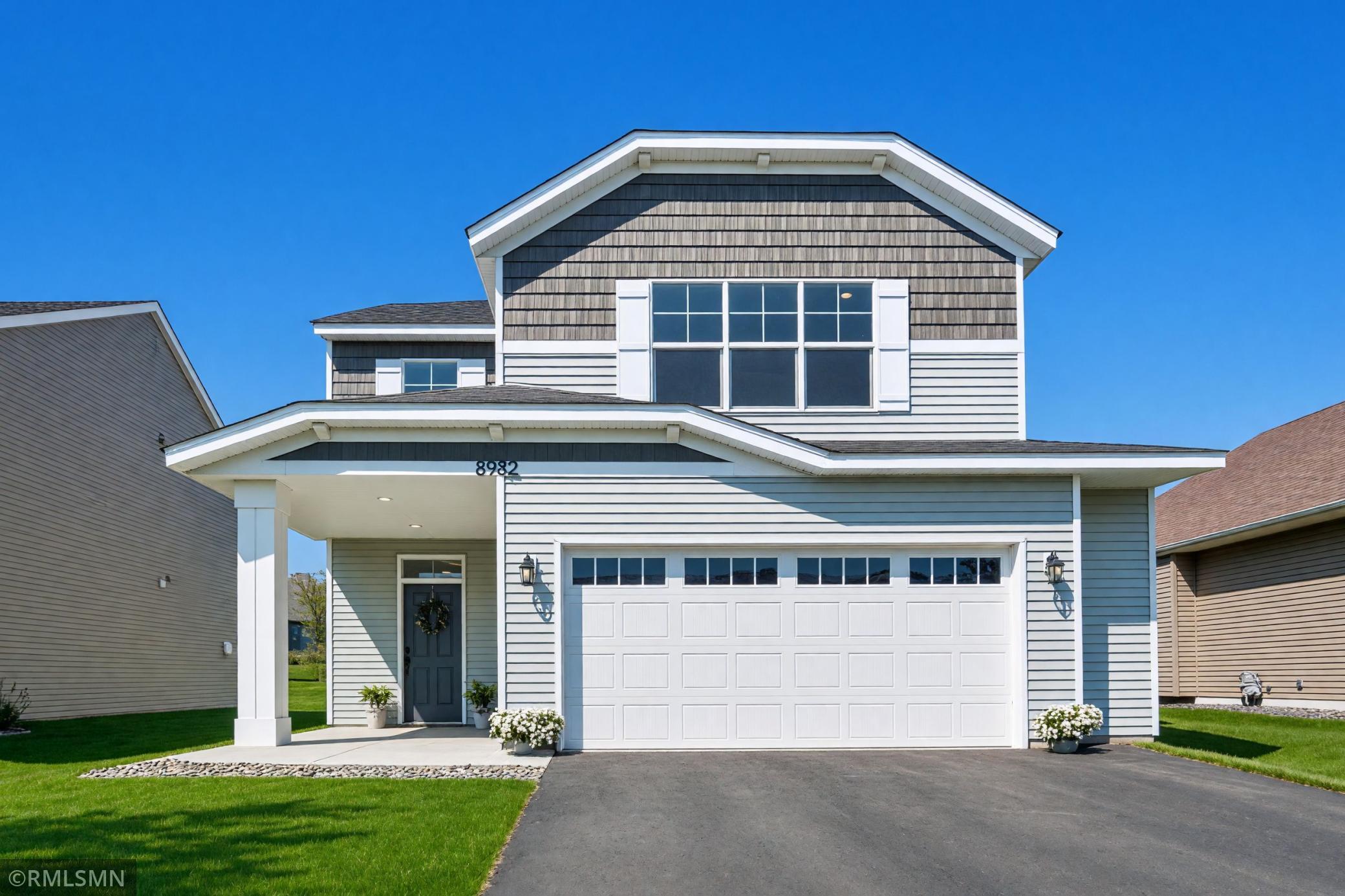 Welcoming exterior with covered front entry