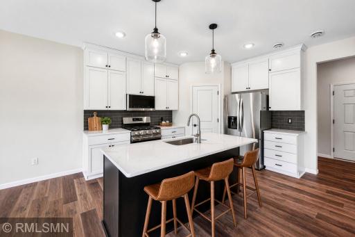 Virtually Staged - Spacious kitchen with large center island and ample cabinetry