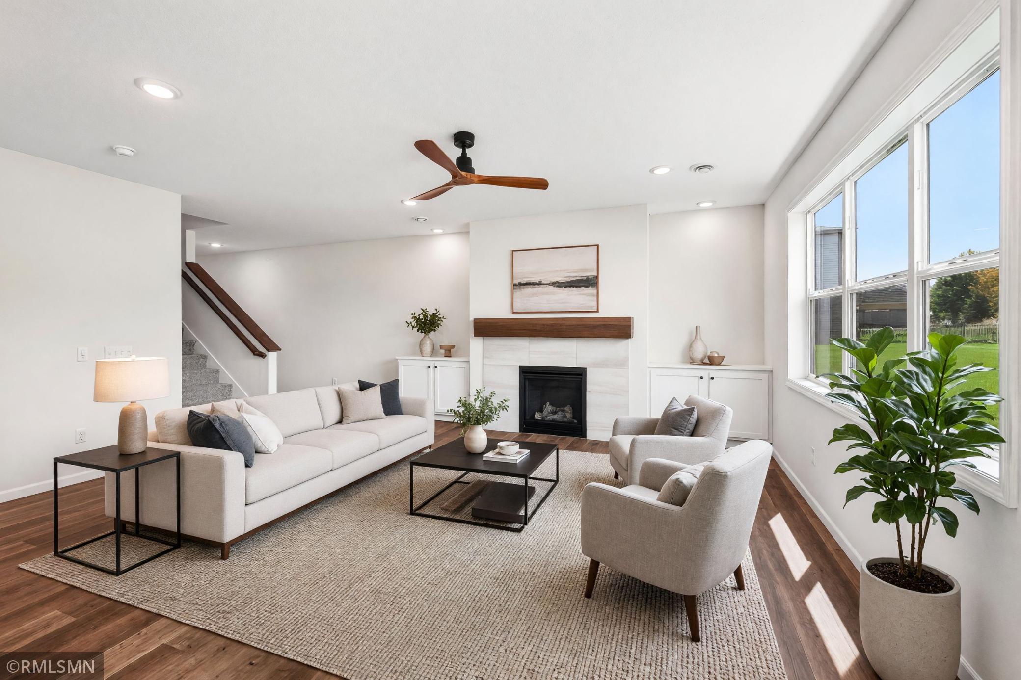 Virtually Staged - Open great room with fireplace and abundant natural light