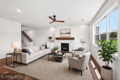 Virtually Staged - Open great room with fireplace and abundant natural light