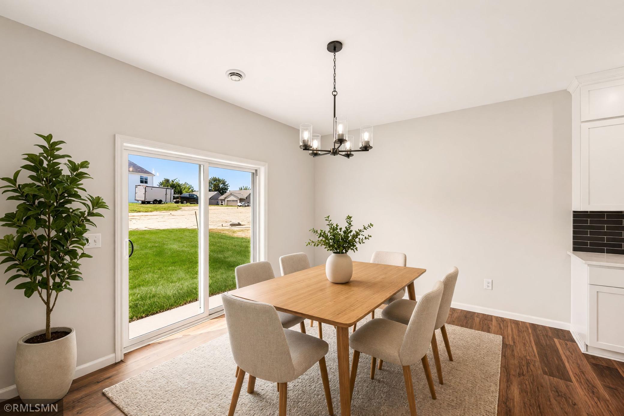 Virtually Staged - Bright dining area with easy access to the backyard
