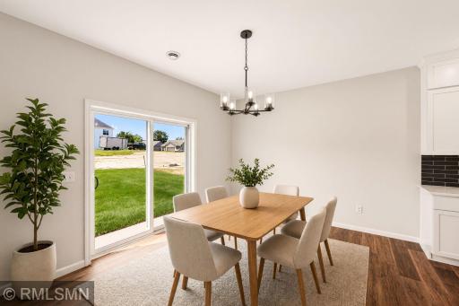 Virtually Staged - Bright dining area with easy access to the backyard