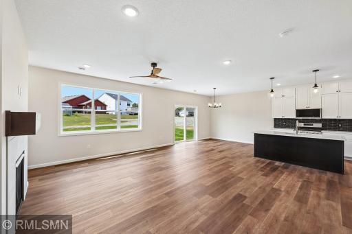 Open-concept layout connecting the kitchen, dining and living spaces