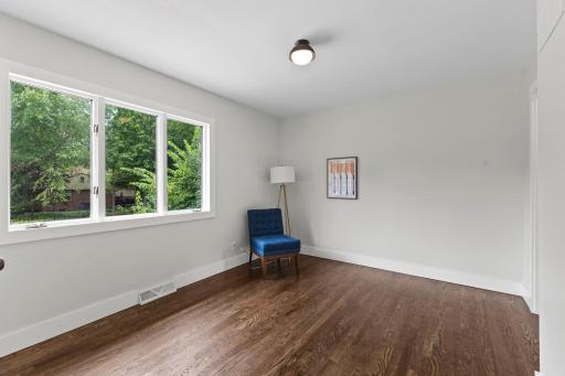 Large flexible room on main level works perfectly as a bedroom, office, or creative space.