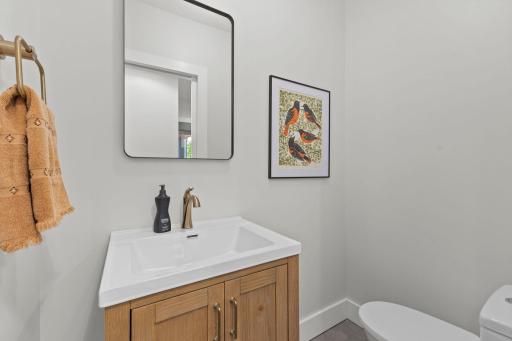 One of three brand-new bathrooms features modern vanity and spa-inspired finishes.
