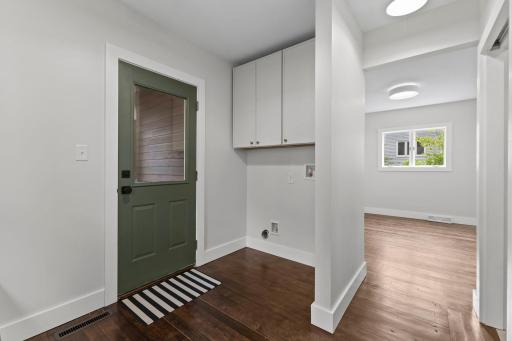 Convenient main-level laundry hookup with abundant storage simplifies modern lifestyle.