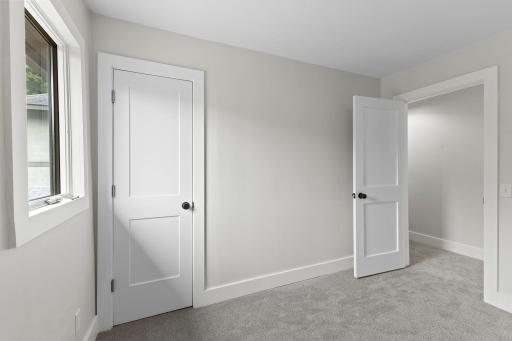 First bedroom on the upper level with brand new carpet.
