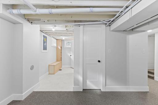 Finished lower level provides space for workout room, studio, or recreation area.