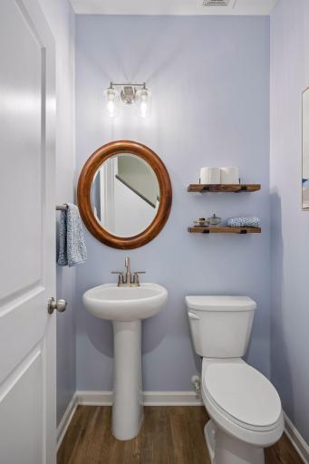 The main level features a convenient half bath.