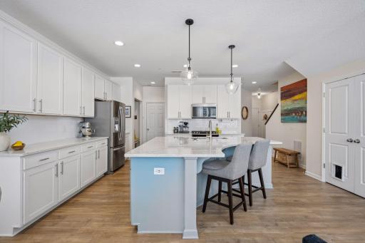 Soft close cabinet doors and drawers, stainless steel appliances, a gas range, and a generous pantry.