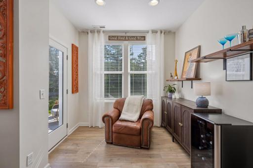 This cozy sun room was an add by the original owner! It's the perfect space to work from home, read, enjoy coffee, bar area, or additional sitting spot.