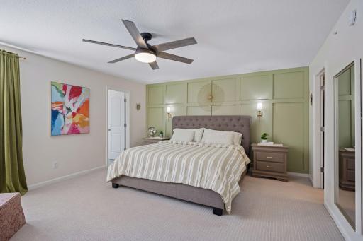 The primary suite features a gorgeous accent wall, TWO walk in closets, and a private 3/4 bathroom.