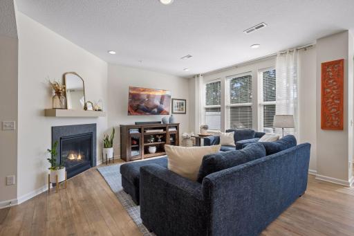 The cozy living room features a gas during fireplace.