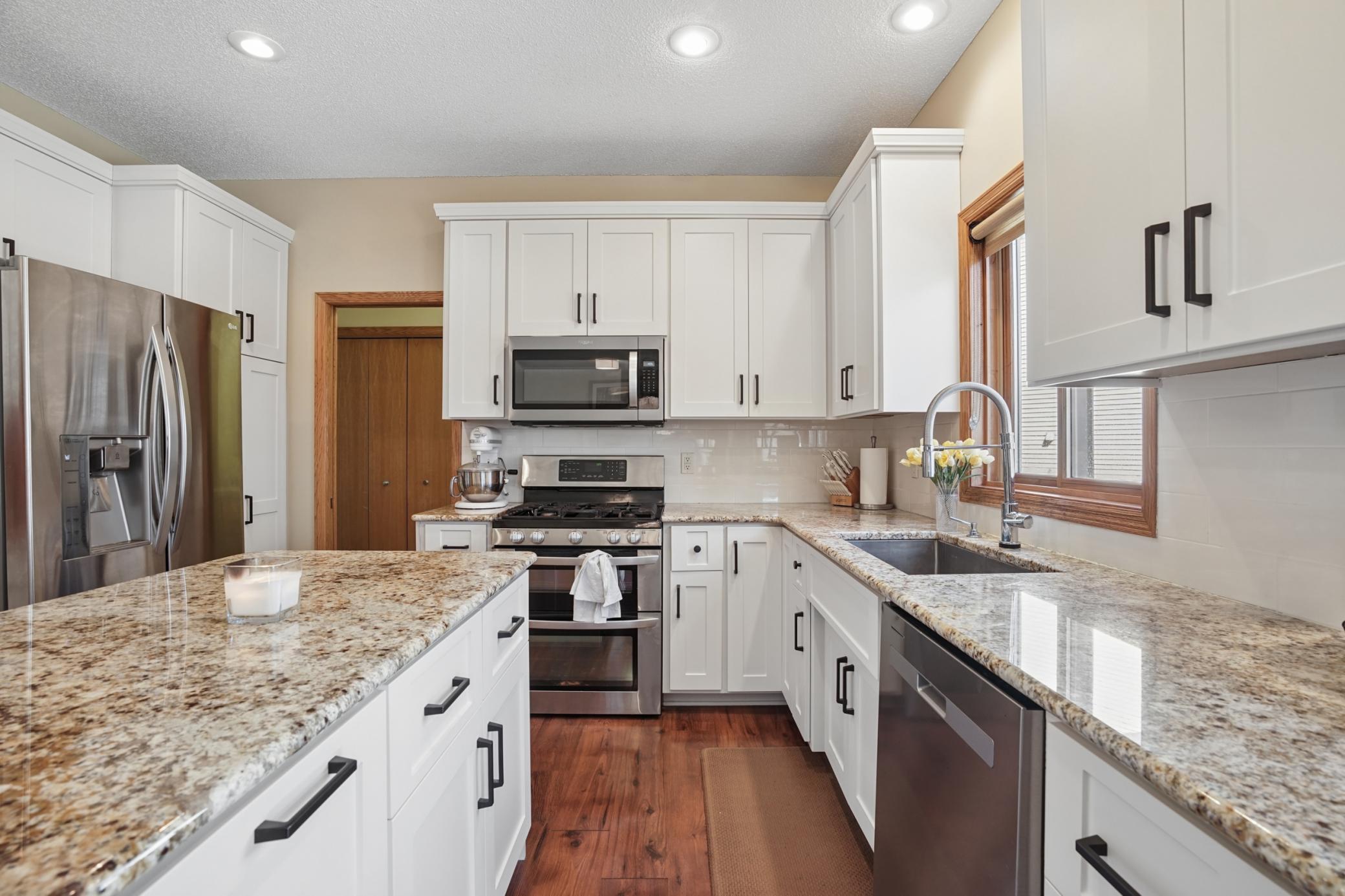 Updated Kitchen with Center Island and Granite Countertops