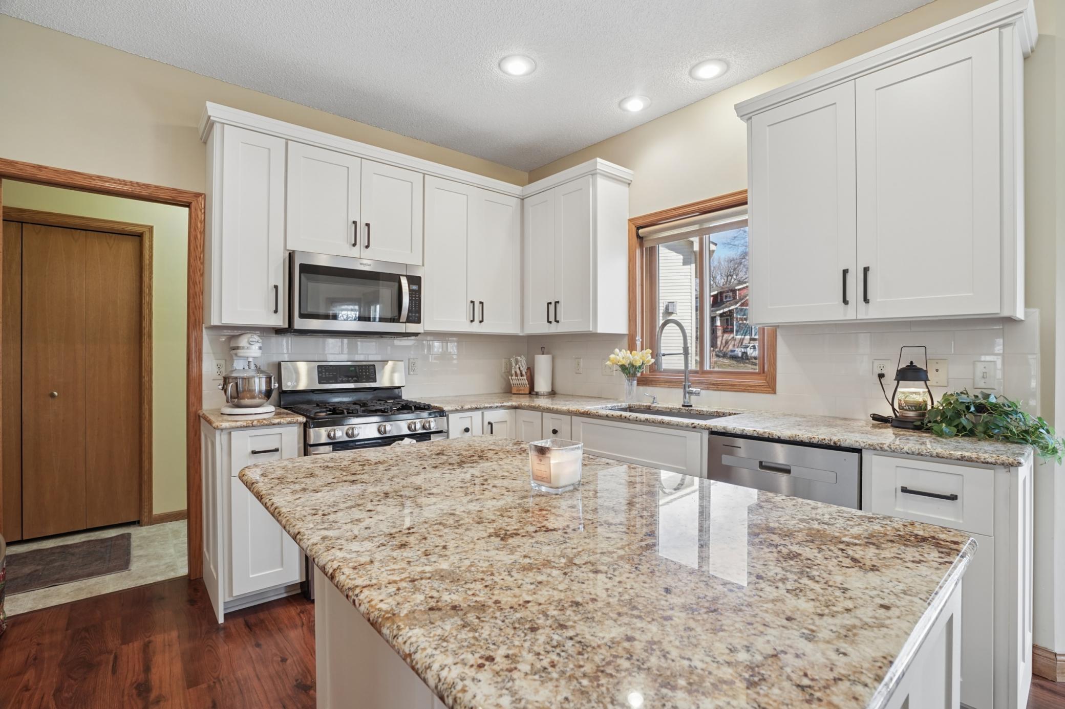 Updated Kitchen with Center Island and Granite Countertops