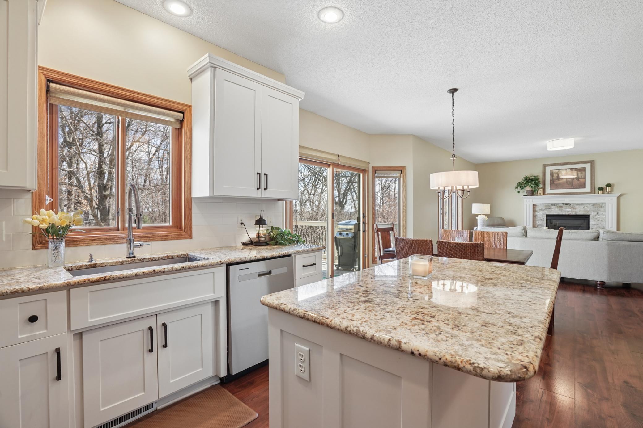 Updated Kitchen with Center Island and Granite Countertops