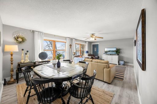 Right off the kitchen you flow into this open concept dining room/living room with large windows overlooking Big Pine Lake.