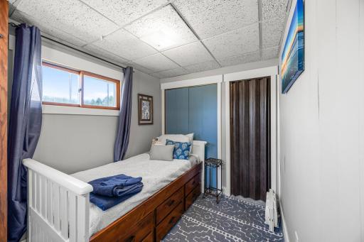 The small but mighty second bedroom on the main floor- a perfect size for your extra guest!