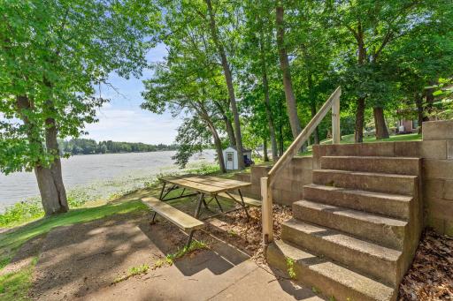 Walkout backyard patio to the firepit and dock area
