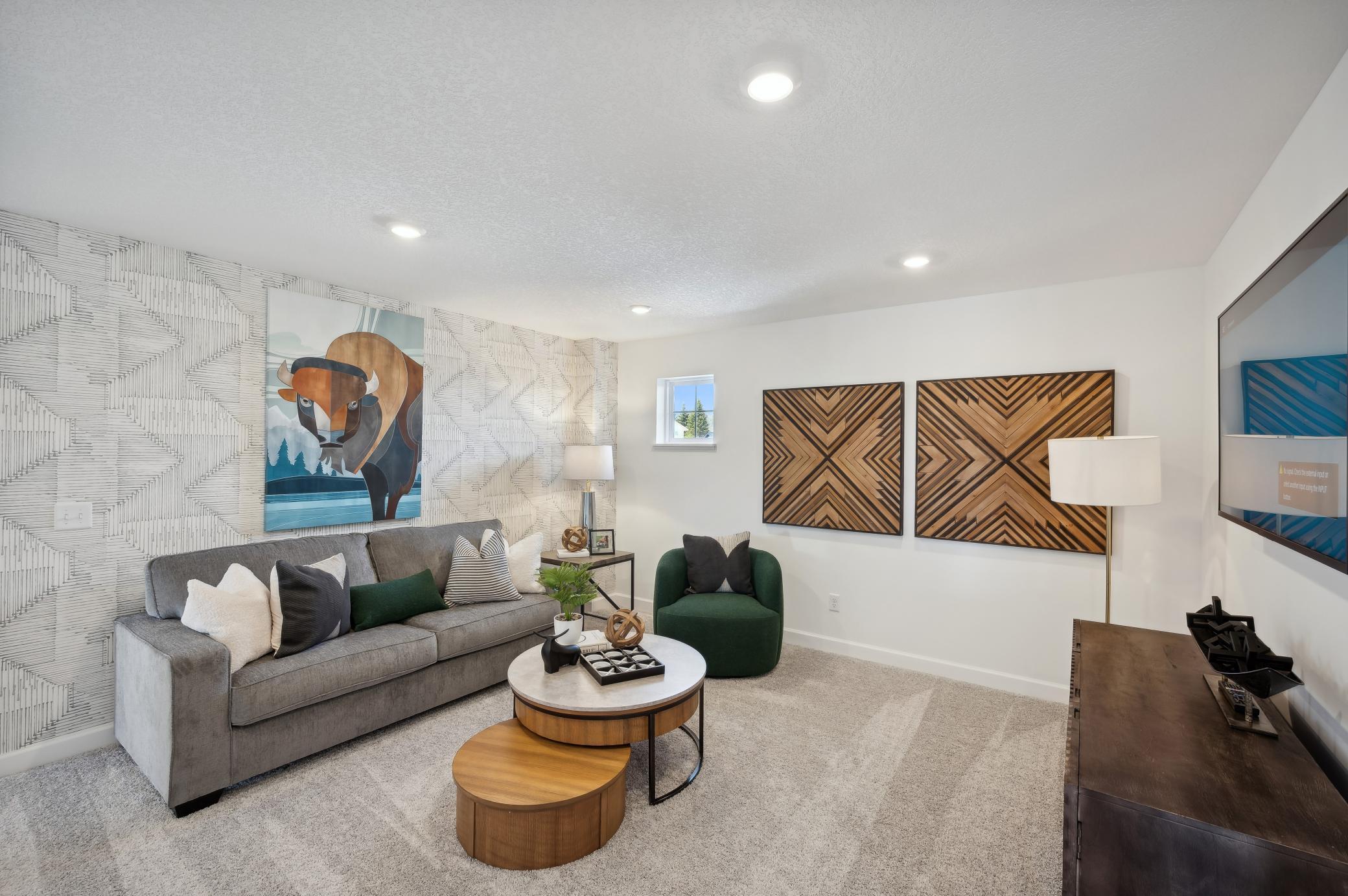 (Photo of model home, finishes will vary) Located on the upper level, this perfectly sized living space has enough room for a desk, television and seating for all. Plus, it is just steps away from all the bedrooms.