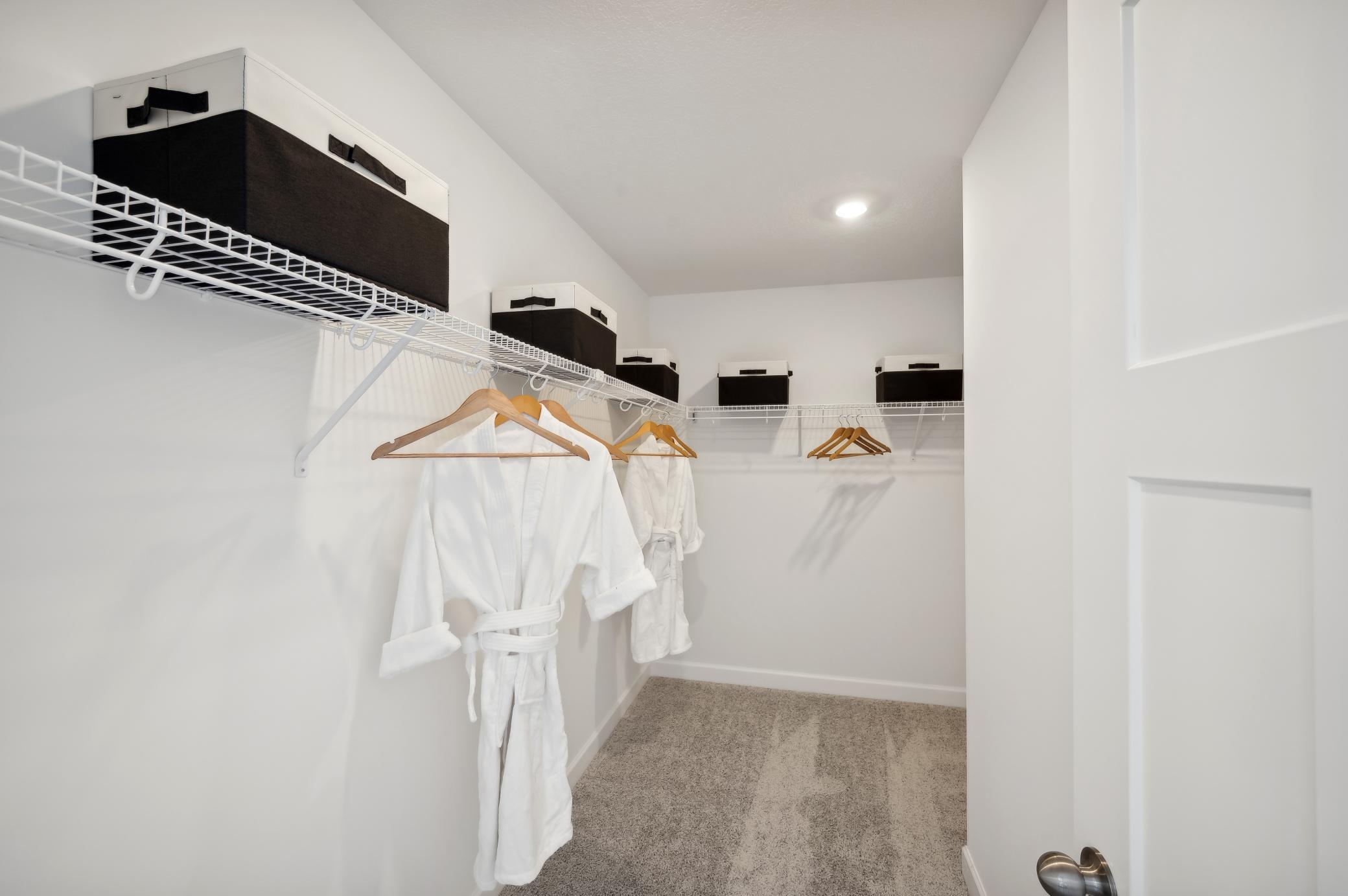 (Photo of model home, finishes will vary) The Owner's walk in closet!