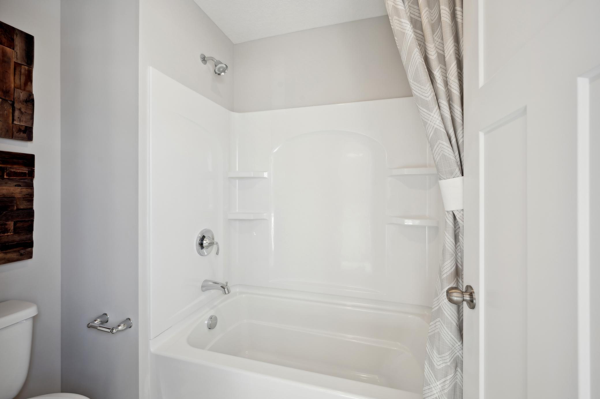 (Photo of model home, finishes will vary)Another angle of the secondary full bath on the upper level!
