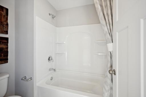 (Photo of model home, finishes will vary)Another angle of the secondary full bath on the upper level!