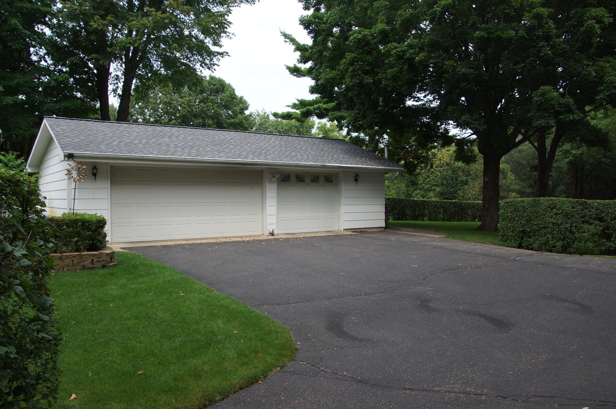 Three plus car garage. Garage is insulated and heated. Possible staging area for new construction.