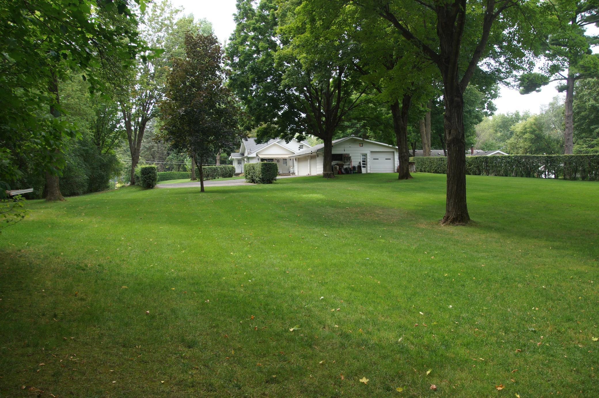 Standing at approximate center of back lot line looking West