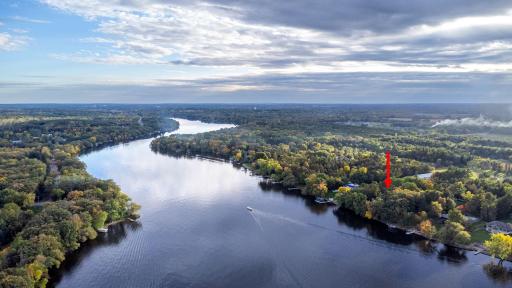 Stunning aerial view showcasing the property's beautiful waterfront location.