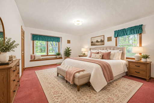 Spacious bedroom with abundant natural light and plenty of room for a full furniture arrangement. Virtually Staged