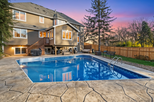 Resort-style backyard with in-ground pool and patio