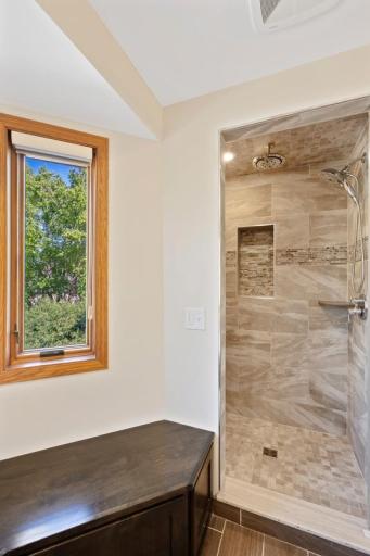 Tiled walk-in shower with built-in niche