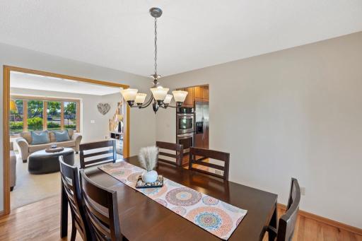 Dining room with chandelier, built-ins and large windows