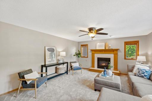 Open-concept living and dining area with oversized windows