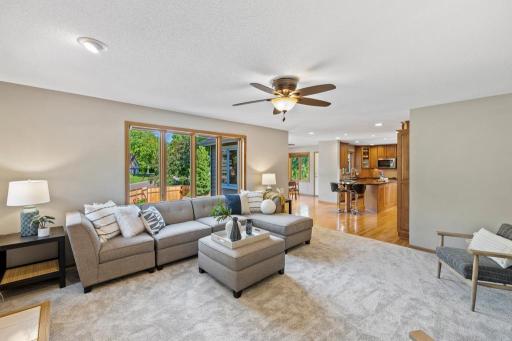 Kitchen with wood cabinetry, island and dining area