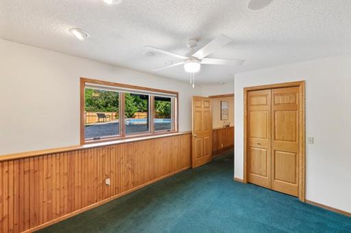 Laundry room with washer, dryer and storage cabinetry