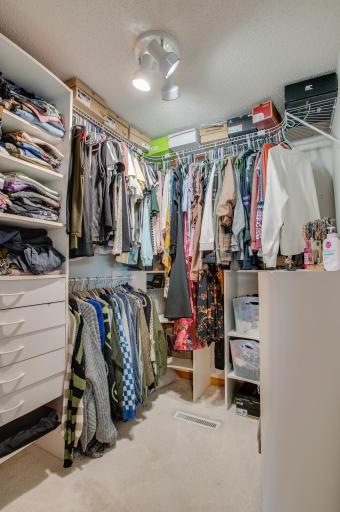 Large primary closet with built in organizers