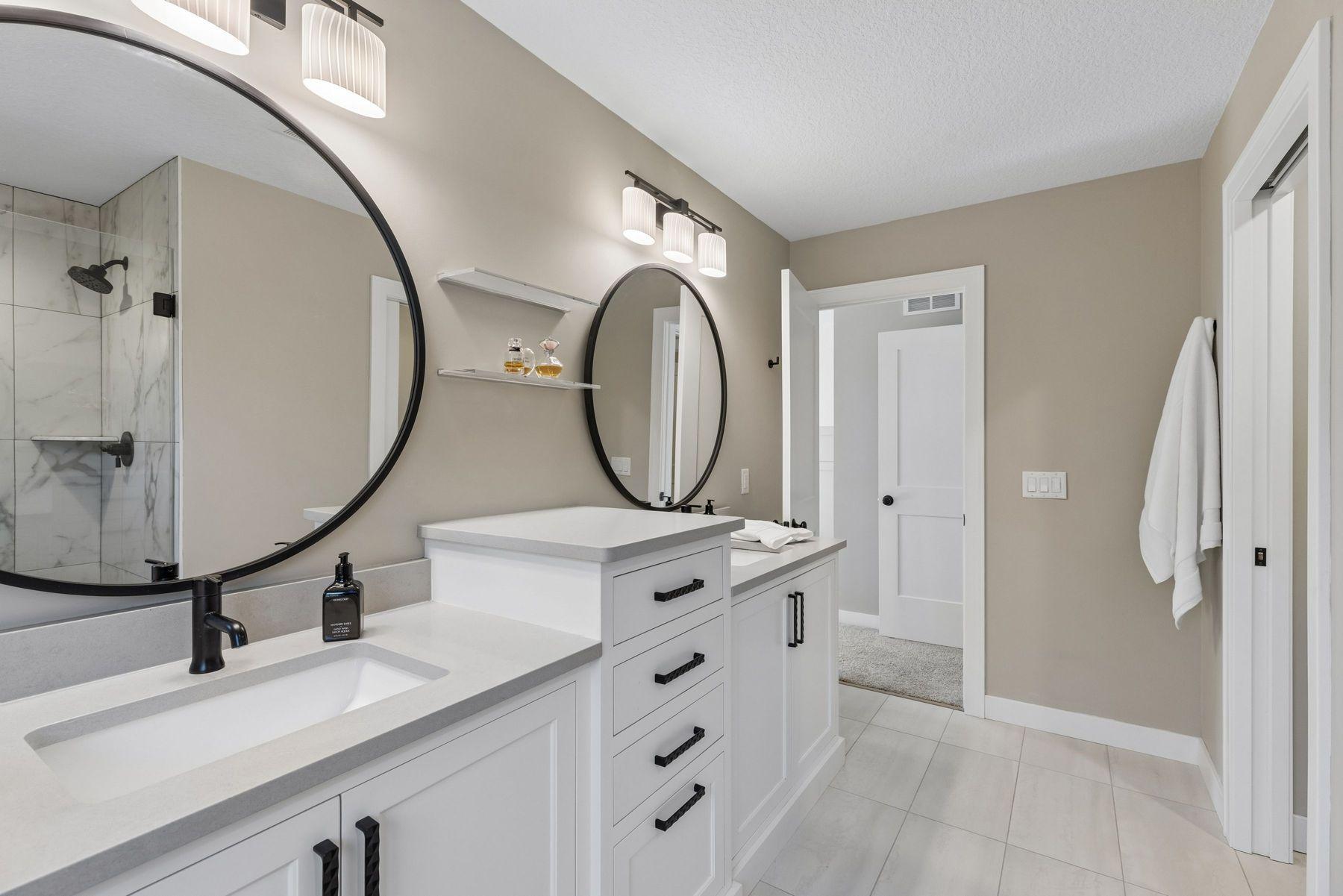 Primary bathroom offers ample storage