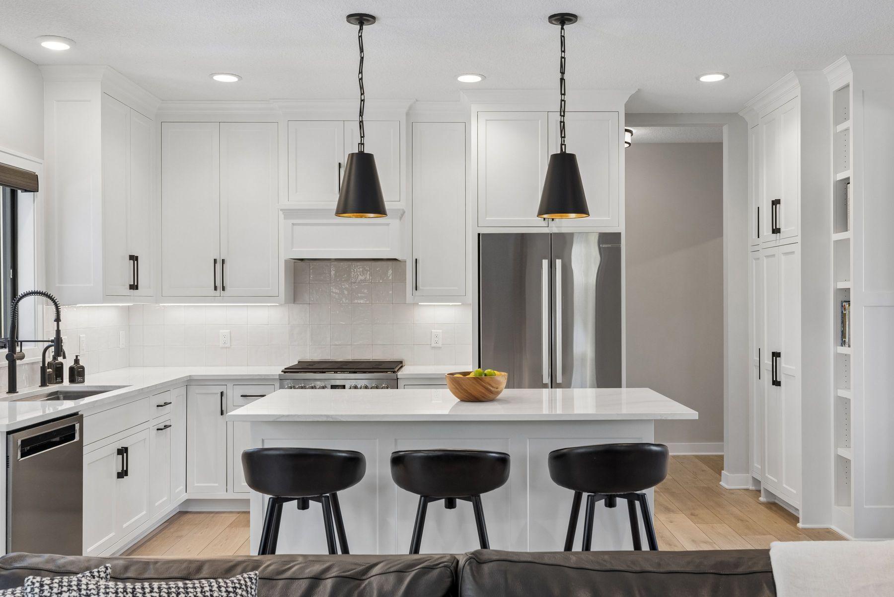 Kitchen island is great for prep space and additional seating