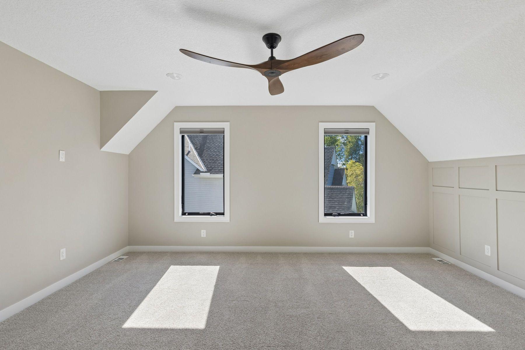 The primary suite at the end of the hall offers wonderful privacy and natural light