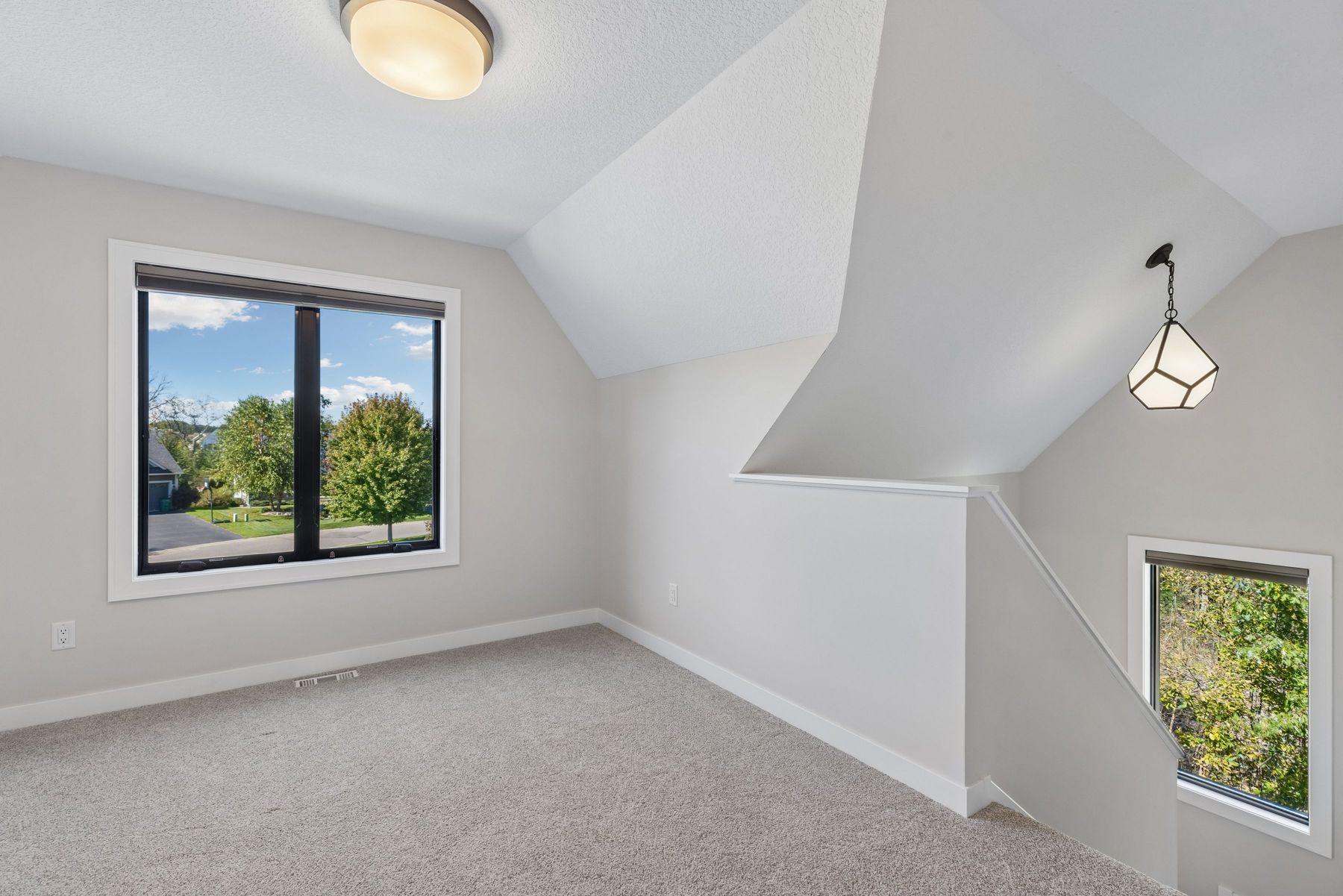 Great loft space could be used as a playroom or TV room