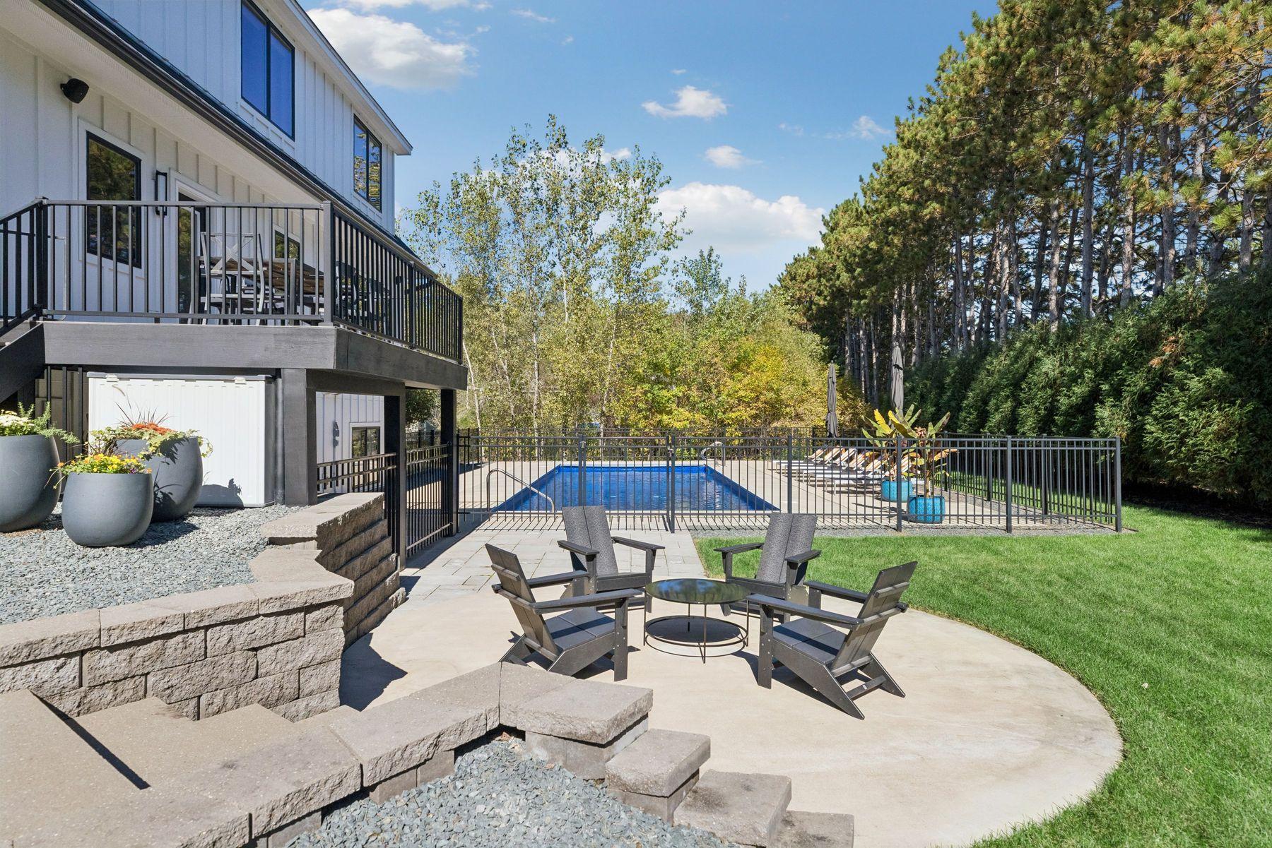 This backyard oasis offers multiple entertaining spaces