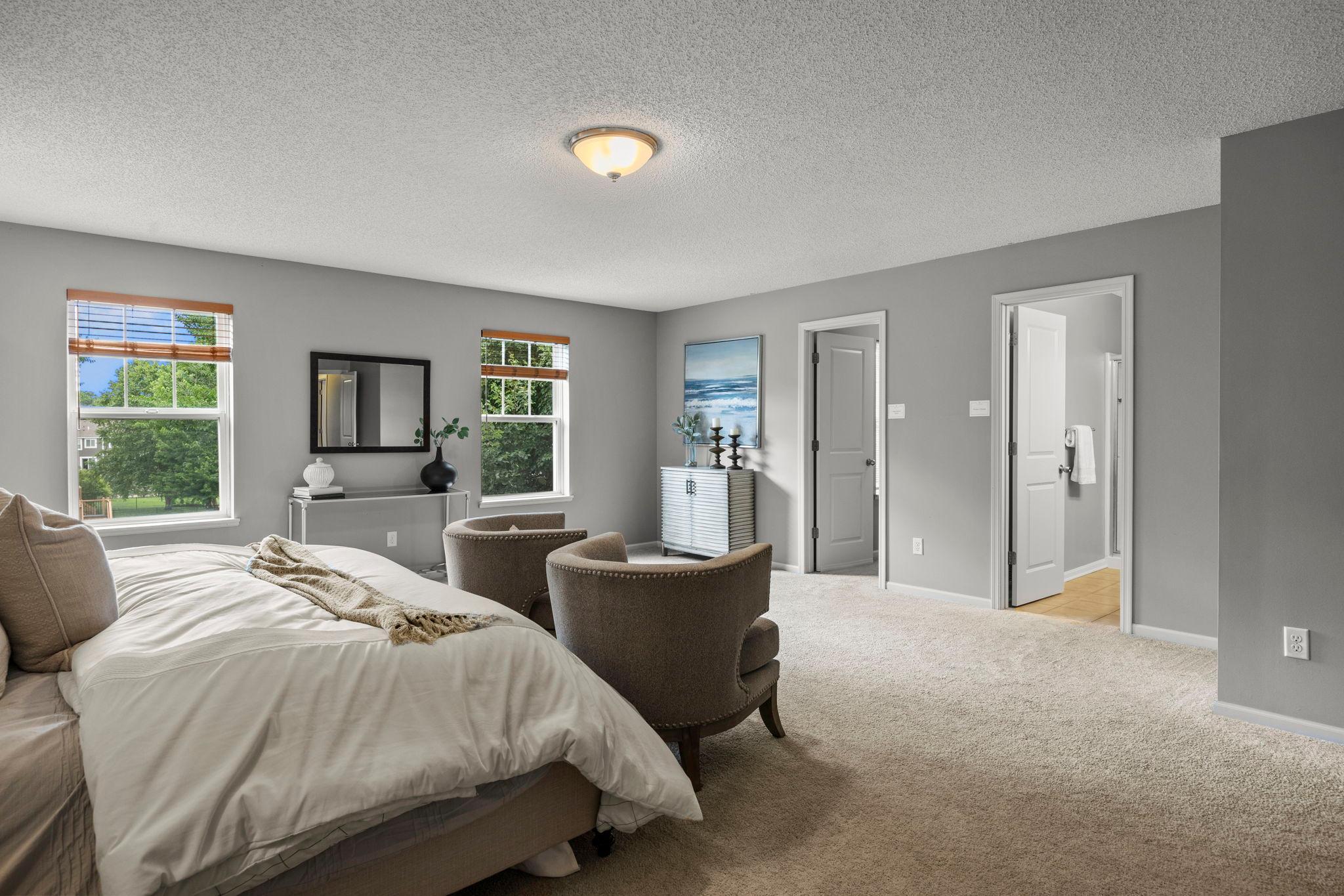 The primary bedroom is a spacious retreat with a sizable walk-in closet!