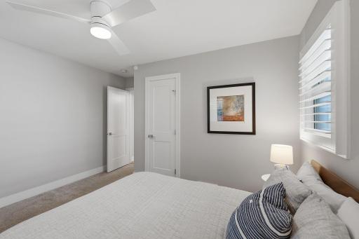 Your second bedroom on the main level features custom closet shelving as well.