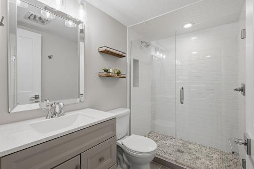 Another beautiful bathroom is positioned between the two lower level bedrooms.