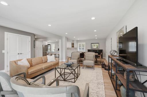 The main level living room flows seamlessly into the dining and kitchen areas.