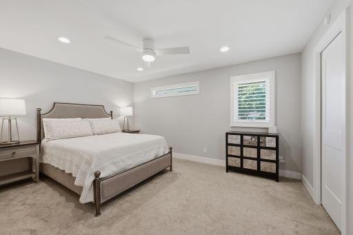 Your main level primary suite offers a walk-in closet featuring customer closets along with your own private bathroom.