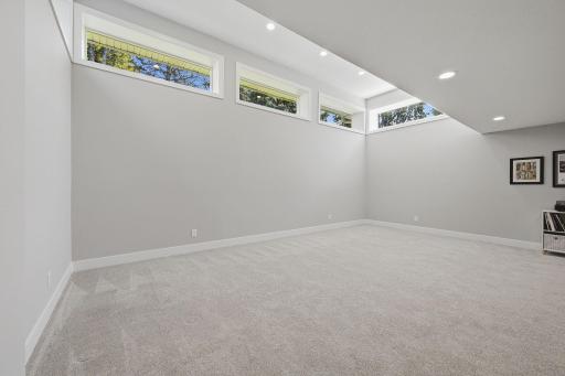 The 13ft ceilings here allow for natural light to pour in-rare for a lower level of this size.