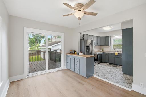 Dining room open to the bright kitchen